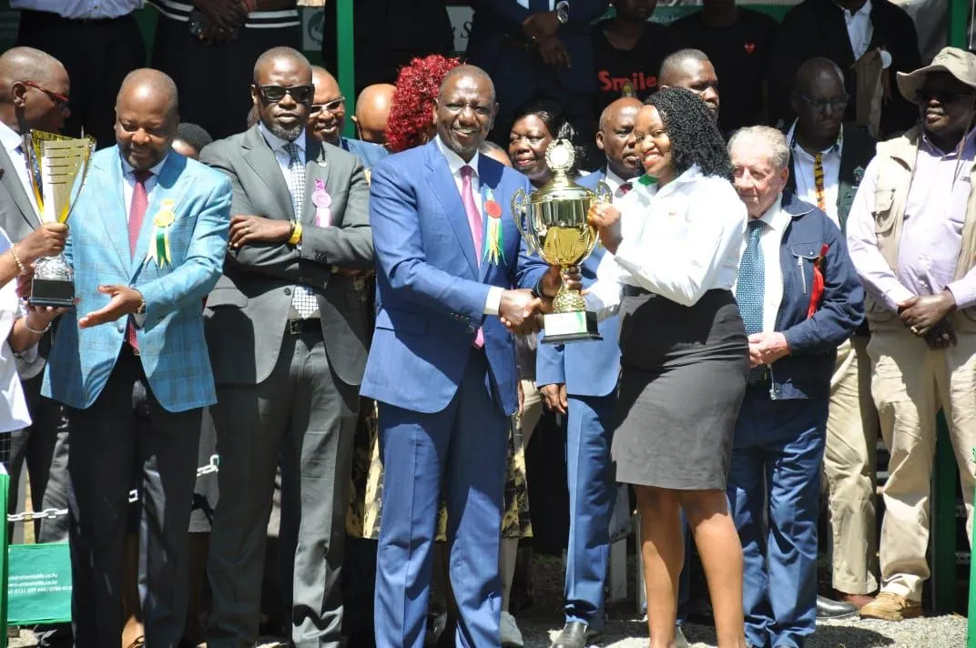 Mercy Munene receiving a trophy from President William Ruto at an Agricultural Society of Kenya show