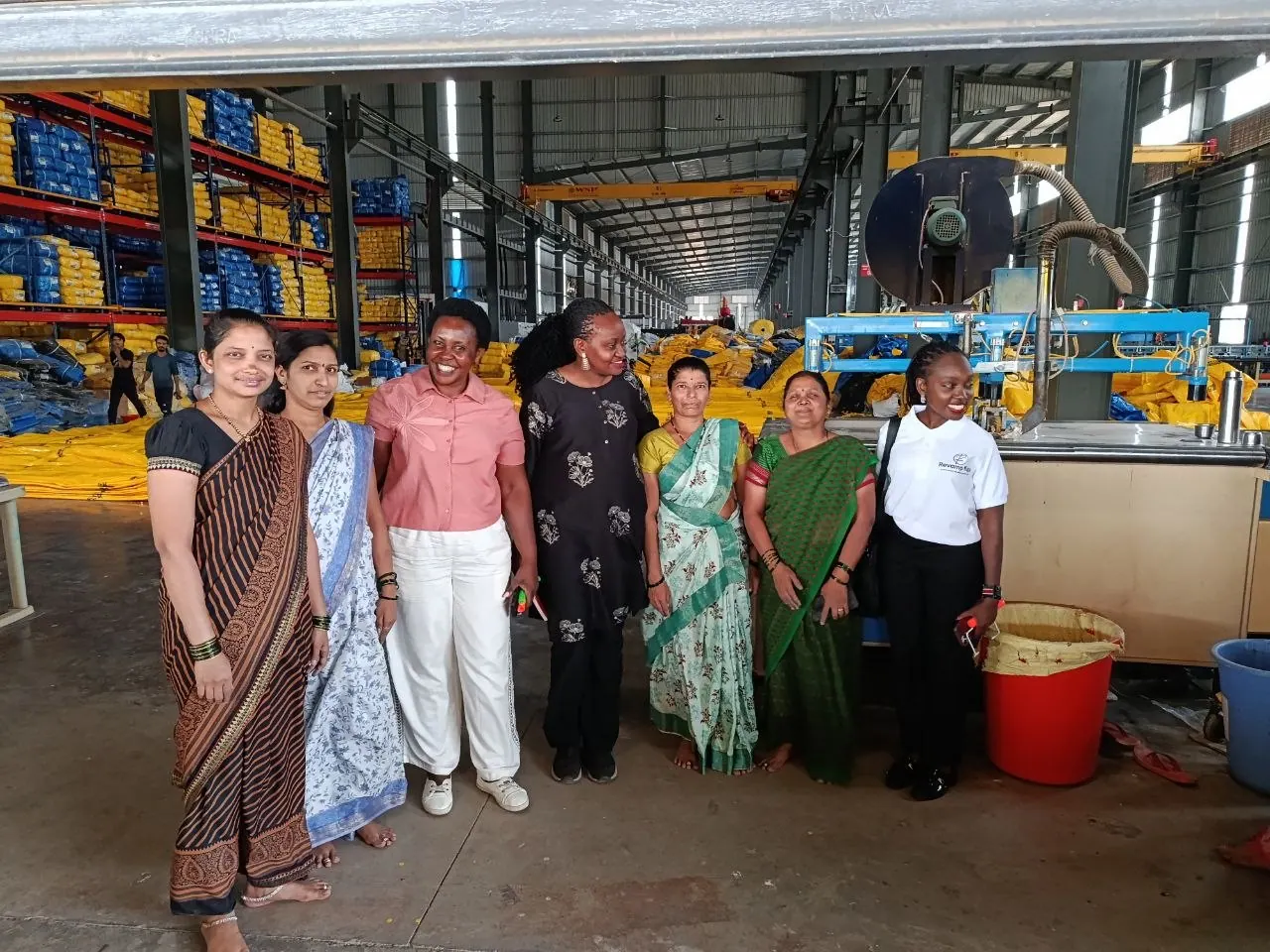 Mercy Munene with women agripreneurs at a processing facility